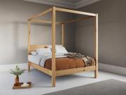 wooden classic four poster bed in honey